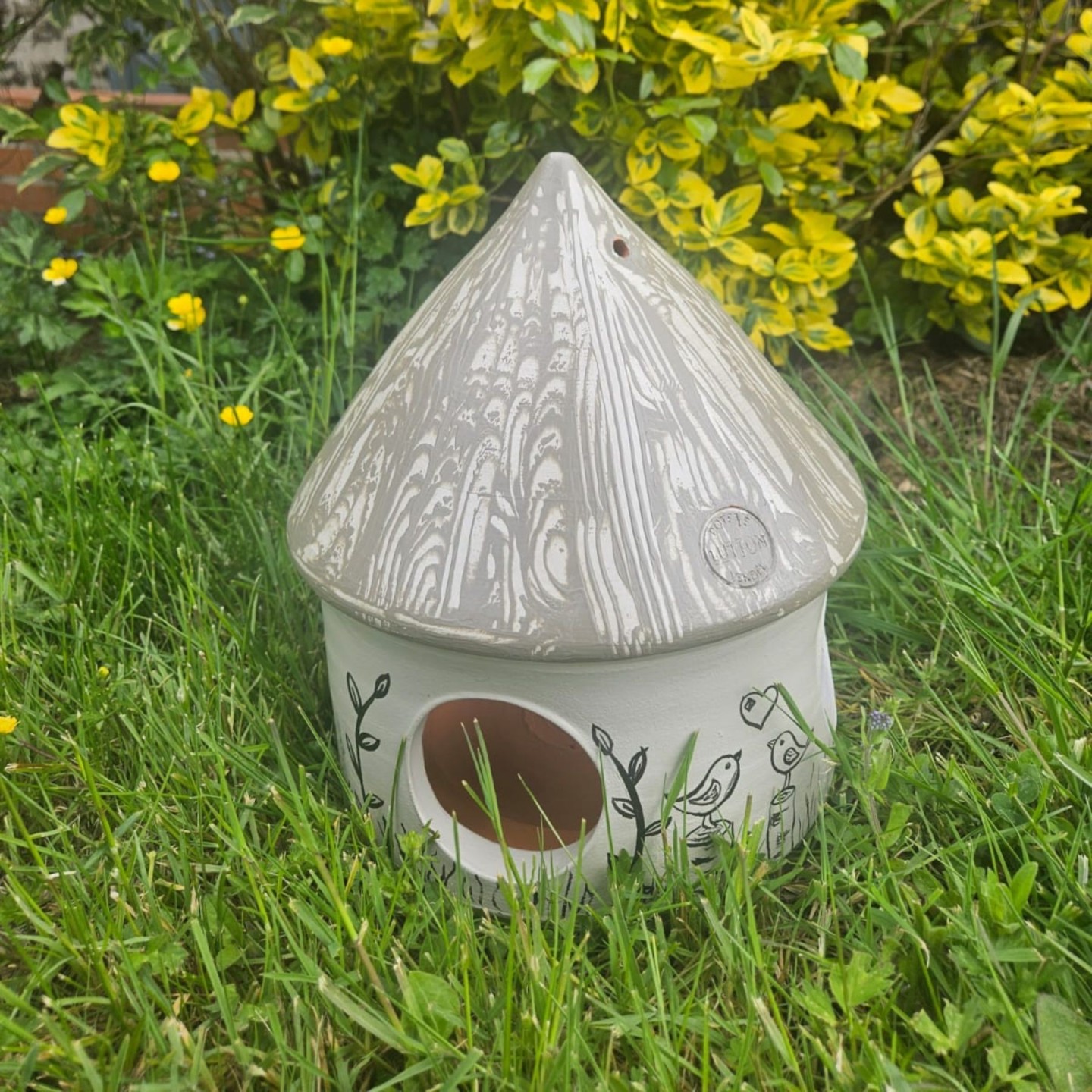 Mangeoire artisanale pour oiseaux en poterie