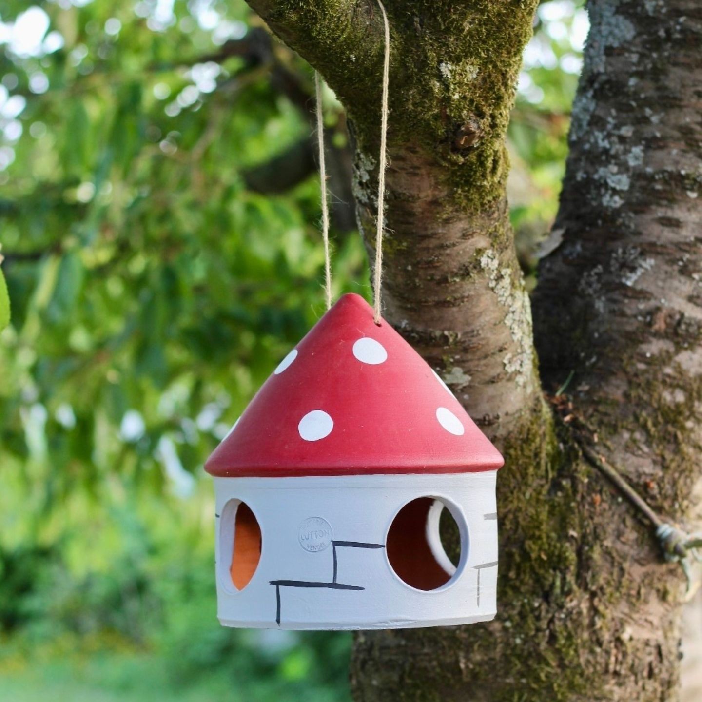 Mangeoire artisanale pour oiseaux en poterie