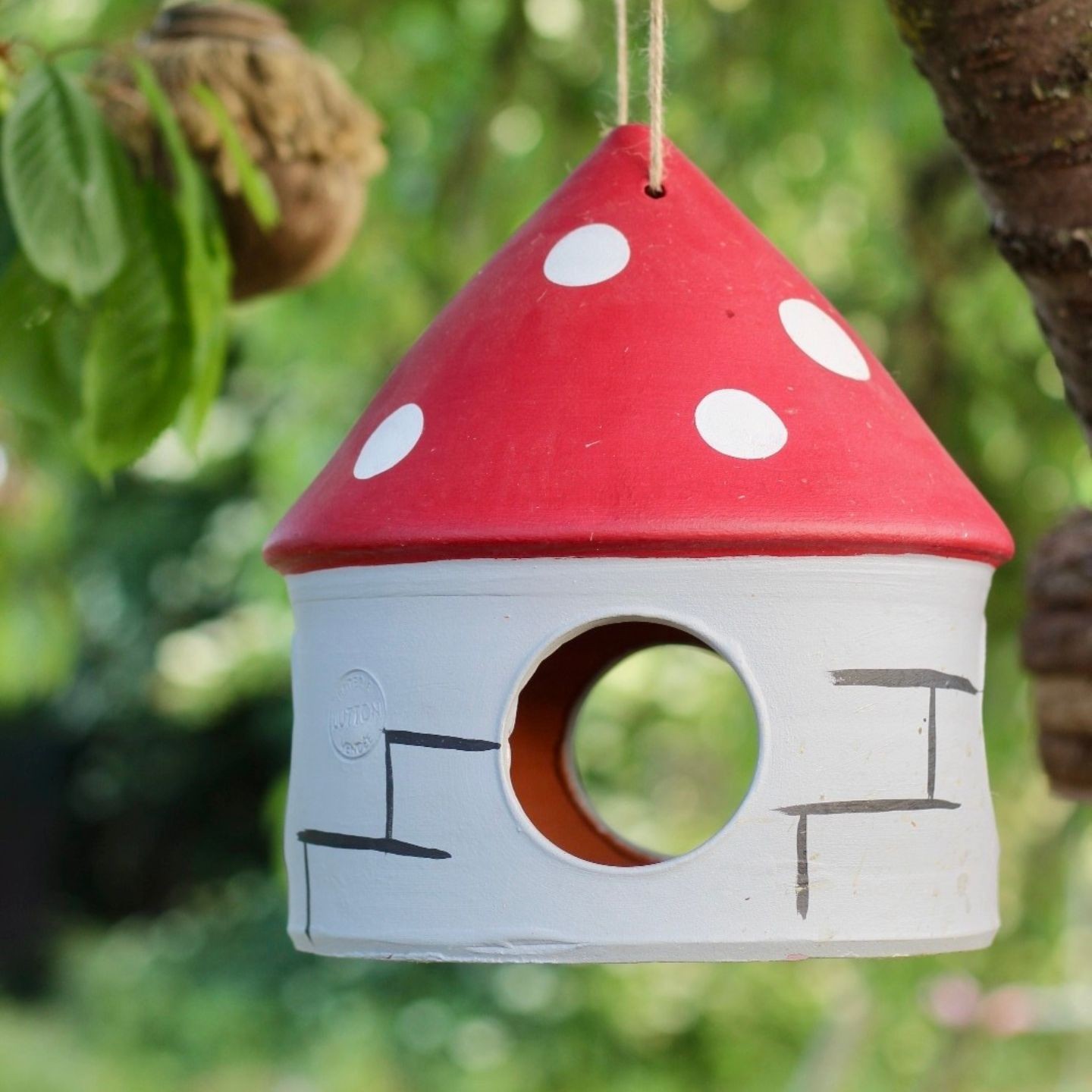 Mangeoire artisanale pour oiseaux en poterie